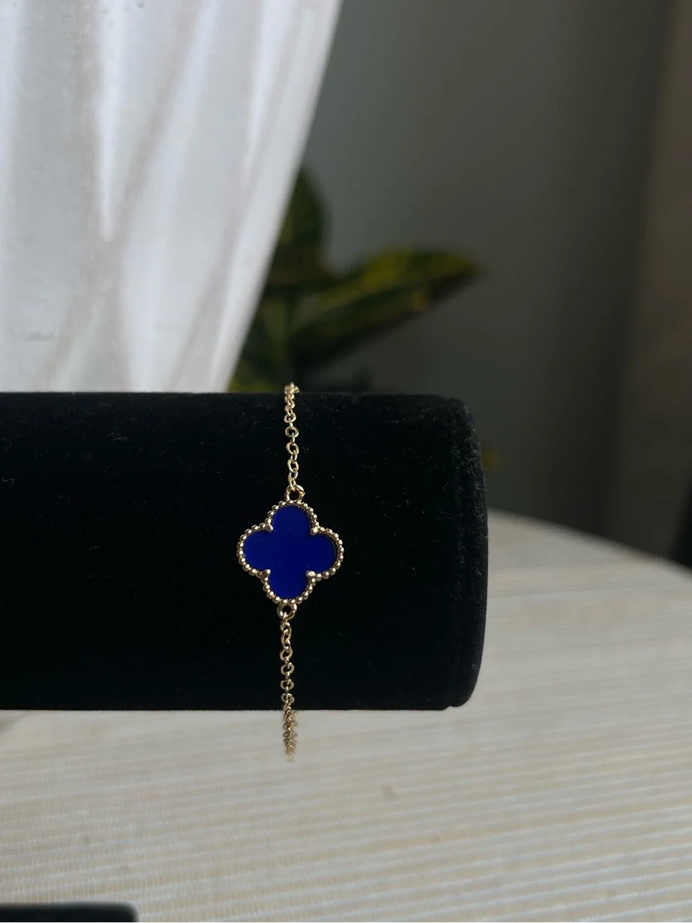 Gold Chain Bracelet with singular  Blue Clover Pendant